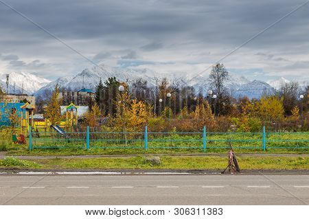 Milkovo, Kamchatka, Russia- 03 October 2014: View Of The Park With A Playground For Children In Milk