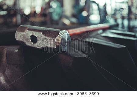 Equipment For Functional Training. Large Rubber Wheel, Hammer Closeup In The Gym. Cross Training