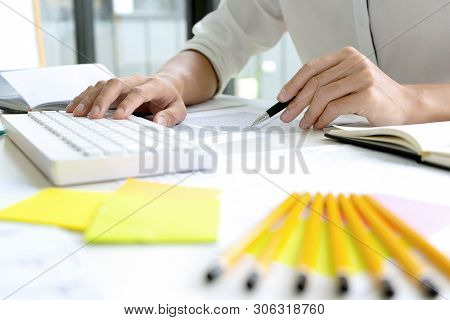 Woman And Man Work For Education Or Business On The Table