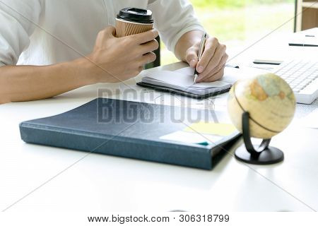 Woman And Man Work For Education Or Business On The Table