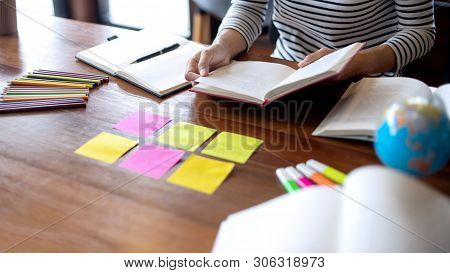 Woman And Man Work For Education Or Business On The Table