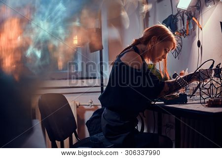 Talanted Young Woman Is Working On Her Own Project At Glass Workshop.