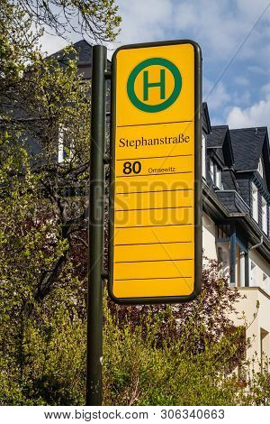 Bus Stop Sign On The Sidewalk In Dresden