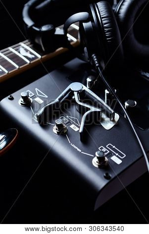 Multieffects Processor For Electric Guitar On Black Background.