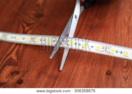 Silicone Led Strip For Installation Of Lighting In The House. Scissors Cut An Extra Pieceribbons Clo