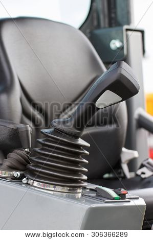 Operating Control Panel And Black Vehicle Seat In Background, Detail And Part Of Industrial Agricult