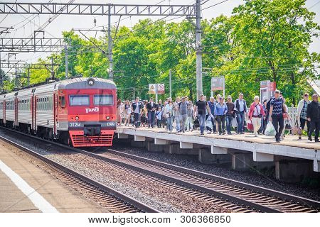 People Got Off The Train. . The Train Has Arrived. People Walk On The Platform. Russia, Leningrad Re