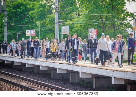 People Got Off The Train. . The Train Has Arrived. People Walk On The Platform. Russia, Leningrad Re
