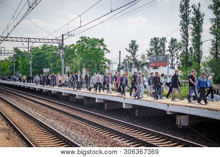 People Got Off The Train. . The Train Has Arrived. People Walk On The Platform. Russia, Leningrad Re