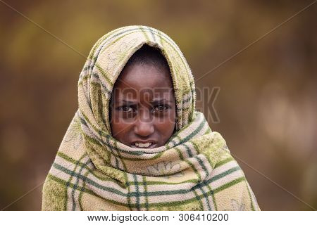 Simien Mountain, Ethiopia, April 25.2019, Little Ethiopian Shepherdess Girl Veiled In A Blanket In C