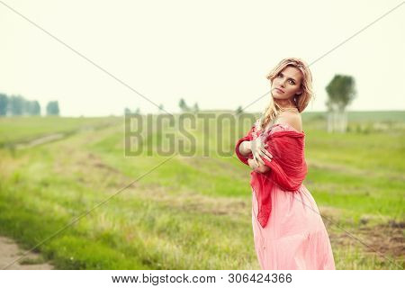 Outdoor Portrait Of A Iddle Aged Blonde Woman