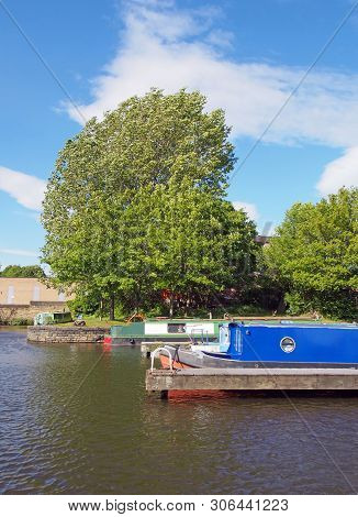 Old Narrow Boats Converted To Houseboats Moored In The Marina At Brighouse Basin In West Yorkshire S