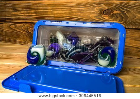 Capsules With Gel For Washing In A Plastic Container
