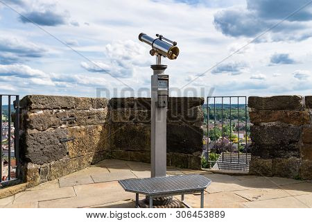 Paid Single Lens Telescope, Set On A High Vantage Point With A View Of The City.