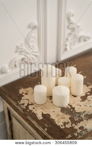 Vintage Chest Of Drawers Decorated With Candles. Close Up. Selective Focus.