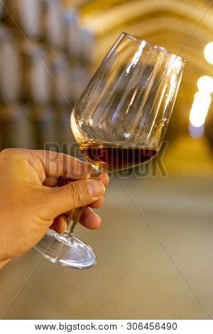 Tasting Of Fortified Dry Or Sweet Marsala Wine In Vintage Wine Cellar With Old Oak Barrels In Marsal