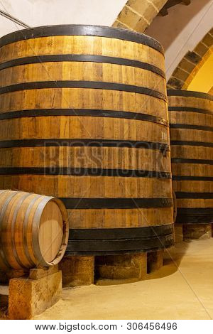 Vintage Wine Cellar With Old Oak Barrels, Production Of Fortified Dry Or Sweet Marsala Wine In Marsa