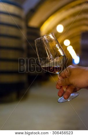 Tasting Of Fortified Dry Or Sweet Marsala Wine In Vintage Wine Cellar With Old Oak Barrels In Marsal