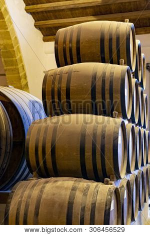 Vintage Wine Cellar With Old Oak Barrels, Production Of Fortified Dry Or Sweet Marsala Wine In Marsa