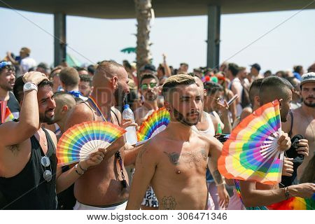 The Annual Parade Lgbt. Gay  Walking In The Gay Pride Parade. Parade Of Tolerance. Rainbow Flags At 