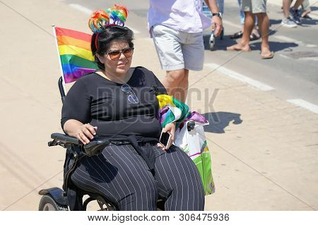 The Annual Parade Lgbt. Woman Lesbian In The Gay Pride Parade. Parade Of Tolerance. Rainbow Flags At