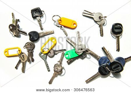 Set Of Many Different Keys Isolated On White Background, Keys With Blank Name Tags, Space For Text. 