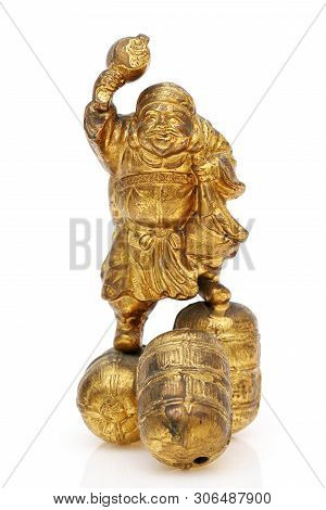 Statuette Of Japanese Daikoku God Isolated On White Background