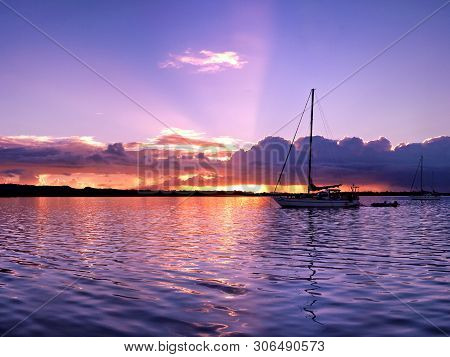 A Delicate Tranquil Lavender Colored Stratocumulus Cloudy Sunset Seascape Over Smooth Sea Water With