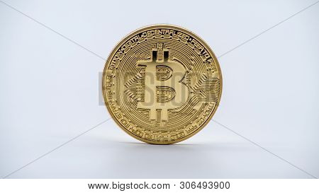 Physical Metal Golden Bitcoin Currency, White Background. Cryptocurrency