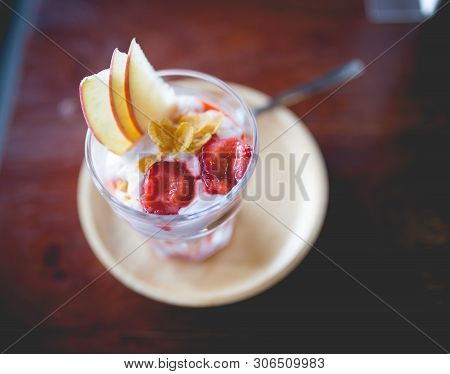 Picture Of A Homemade Fruit Yoghurt With Strawberry Jam, Apple And Conflake