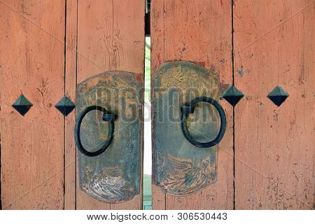 Ancient Gates With Door Handles And Copper Plates Engraved In The Shape Of Dragons In Medieval Koryo