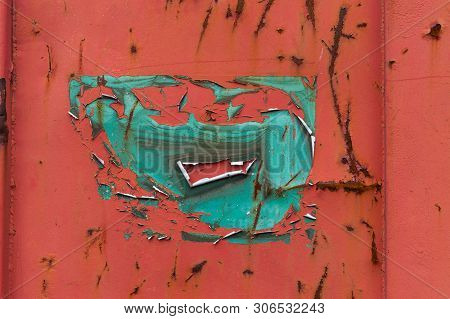 Impression Of A Face, Formed By Natural Erosion Of Paint On A Shipping Container.  This Illustrates 