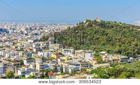 Panorama Of Athens With Philopappu Or Muse Hill, Greece. It Is A Tourist Attraction Of Athens. Sceni