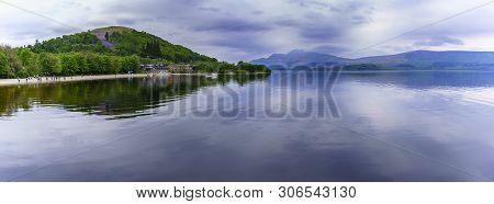 Panoramic Image Of Beautiful Tranquil Scenery Of Loch Lomond In Luss With Reflection , Scotland
