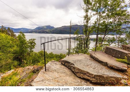 Norwegian Landscape. Green Mountains Hills And Fjord Saudafjord On Overcast Weather, View From Svand