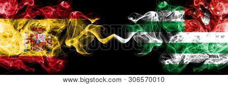 Spain Vs Abkhazia, Abkhazian Smoky Mystic Flags Placed Side By Side. Thick Colored Silky Smokes Flag