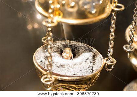 Golden Chain Censer With Incense On Burning Charcoal. Close-up. During Divine Liturgy In Eastern Chu