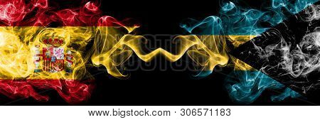 Spain Vs Bahamas, Bahamian Smoky Mystic Flags Placed Side By Side. Thick Colored Silky Smokes Flag O