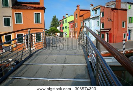 Brdige Of Burano Island Near Venice In Italy And The Painted Houses