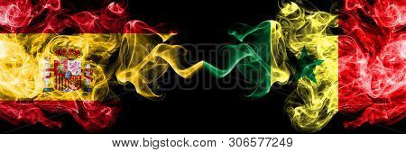 Spain Vs Senegal, Senegalese Smoky Mystic Flags Placed Side By Side. Thick Colored Silky Smokes Flag