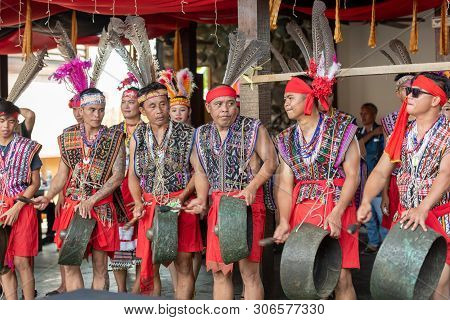 Kota Kinabalu, Malaysia - May 31, 2019: Native Borneo Men Playing Gong During State Level Harvest Fe