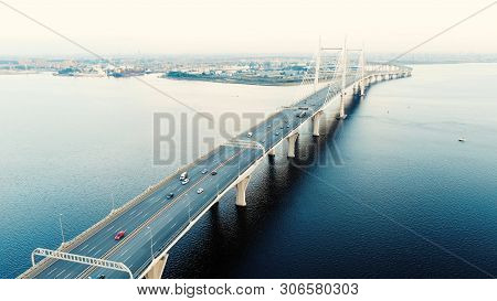 Cable-stayed Bridge With High Pylons And Speeding Cars
