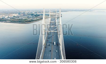 Cable-stayed Bridge Against Beautiful City Line Among Water