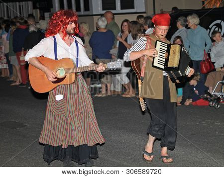 Sidmouth, Devon, England - August 10th 2012: Two Performers In Fancy Dress Play A Guitar And An Acco