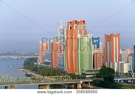 Pyongyang, North Korea - May 3, 2019: Aerial View Of New Residential Complex And Taedong River, Capi