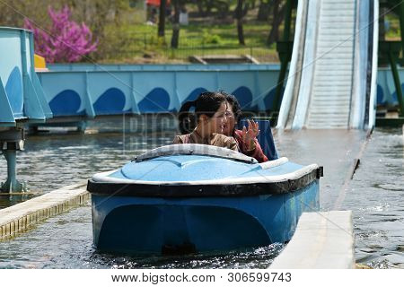 Pyongyang, North Korea - May 1, 2019: Happy Daughter And Her Elderly Mother In Boat Riding On Water 