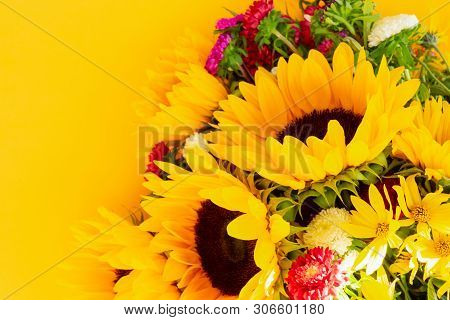 Sunflowers And Aster Fresh Flowers, Top View On Yellow Background, Top View, Naturall Fall Flowers B
