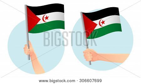 Sahrawi Arab Democratic Republic Flag In Hand. Patriotic Background. National Flag Of Sahrawi Arab D
