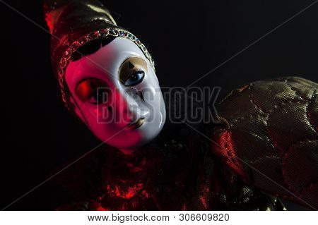 Beautiful Mysterious Porcelain Jester Doll, Close-up Photo.