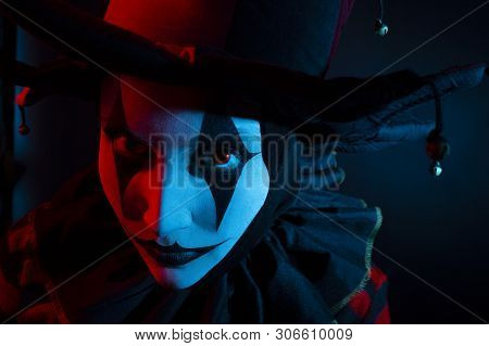 Serious Jester's Or Clown's Face, Close-up. Halloween Concept.
